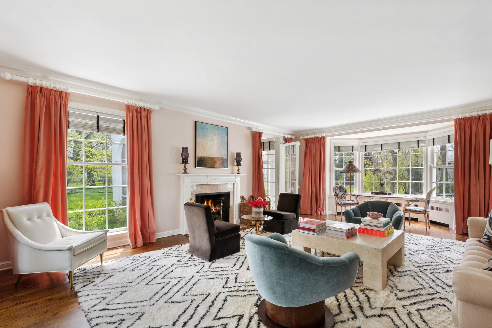 220 Dewindt Road Winnetka, IL 60093 - Photo 8 of 53 a living room with furniture a fireplace and a large window