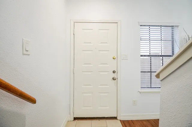 a bedroom with a large bed and a fireplace