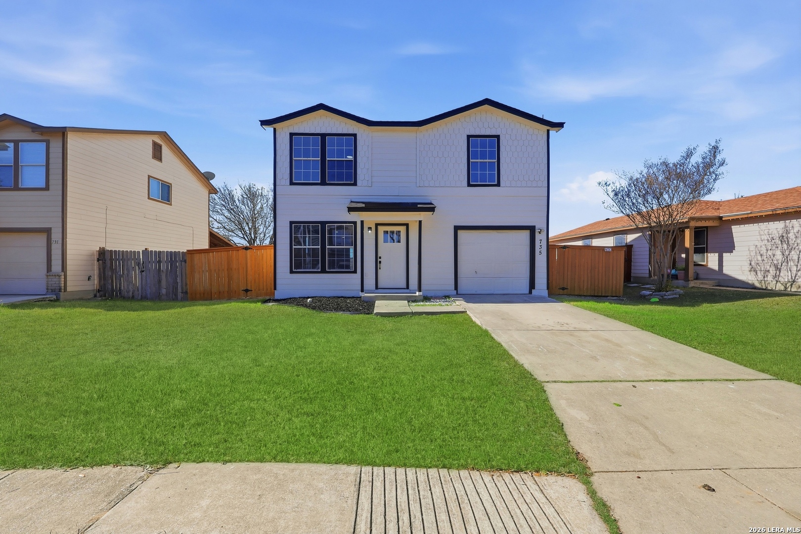a house view with a garden space