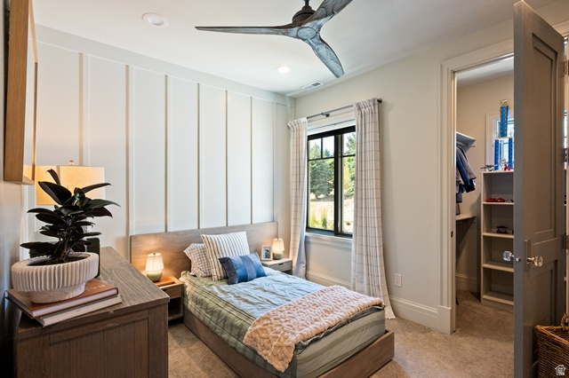 3 Carriagewood Cove, Unit 1088 Sandy, UT 84092 - Photo 39 of 79 Bedroom featuring board and batten accent wall, recessed lighting, and a modern ceiling fan