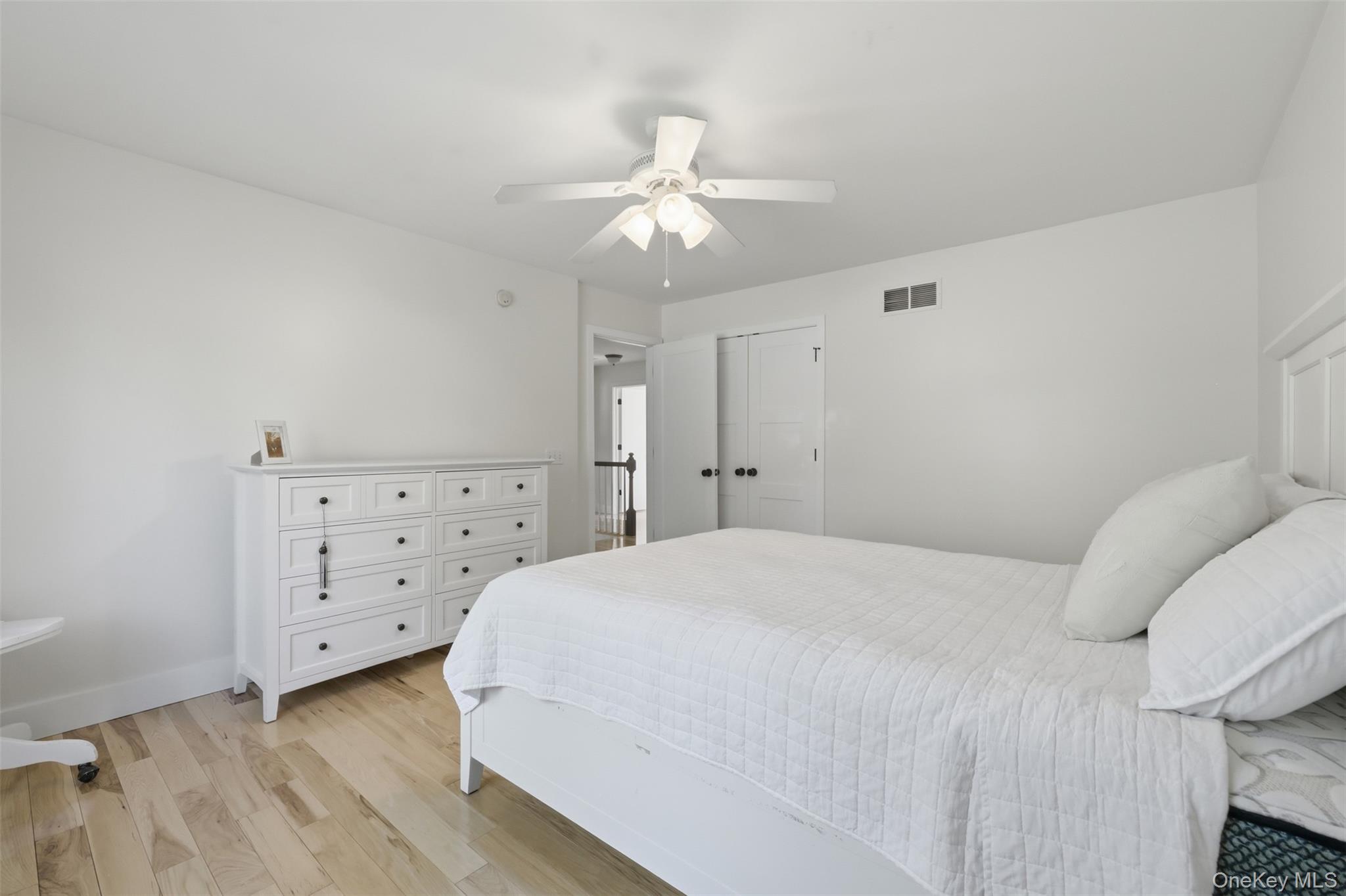 233 Devon Farms Road Stormville, NY 12582 - Photo 31 of 48 a bedroom with a bed and a ceiling fan