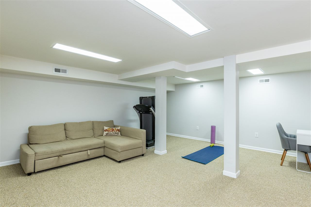103 Crest Road Cary, NC 27513 - Photo 25 of 30 Large room for TV, kids play, exercise, office, etc. Direct access to back patio. Rec Room