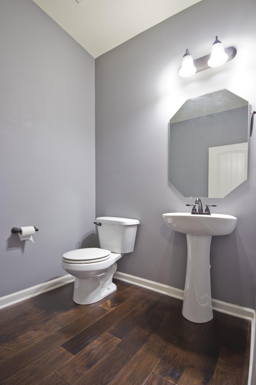 1011 Kyle Road Spring Hill, TN 37174 - Photo 11 of 30 a bathroom with a sink toilet and a mirror