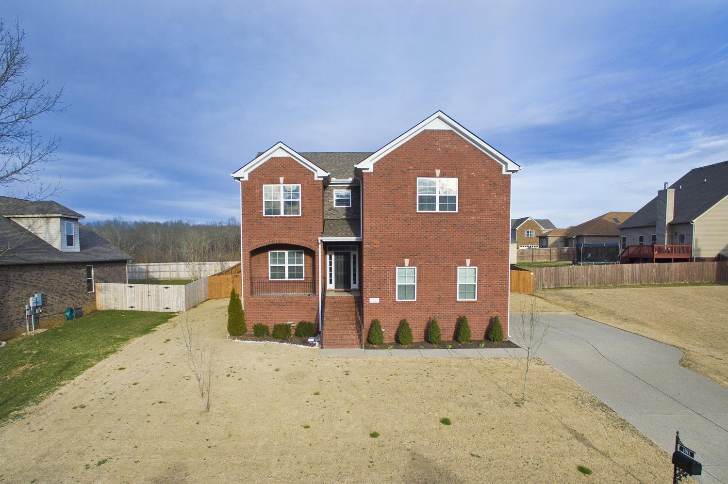 1011 Kyle Road Spring Hill, TN 37174 - Photo 2 of 30 a front view of a house with a yard