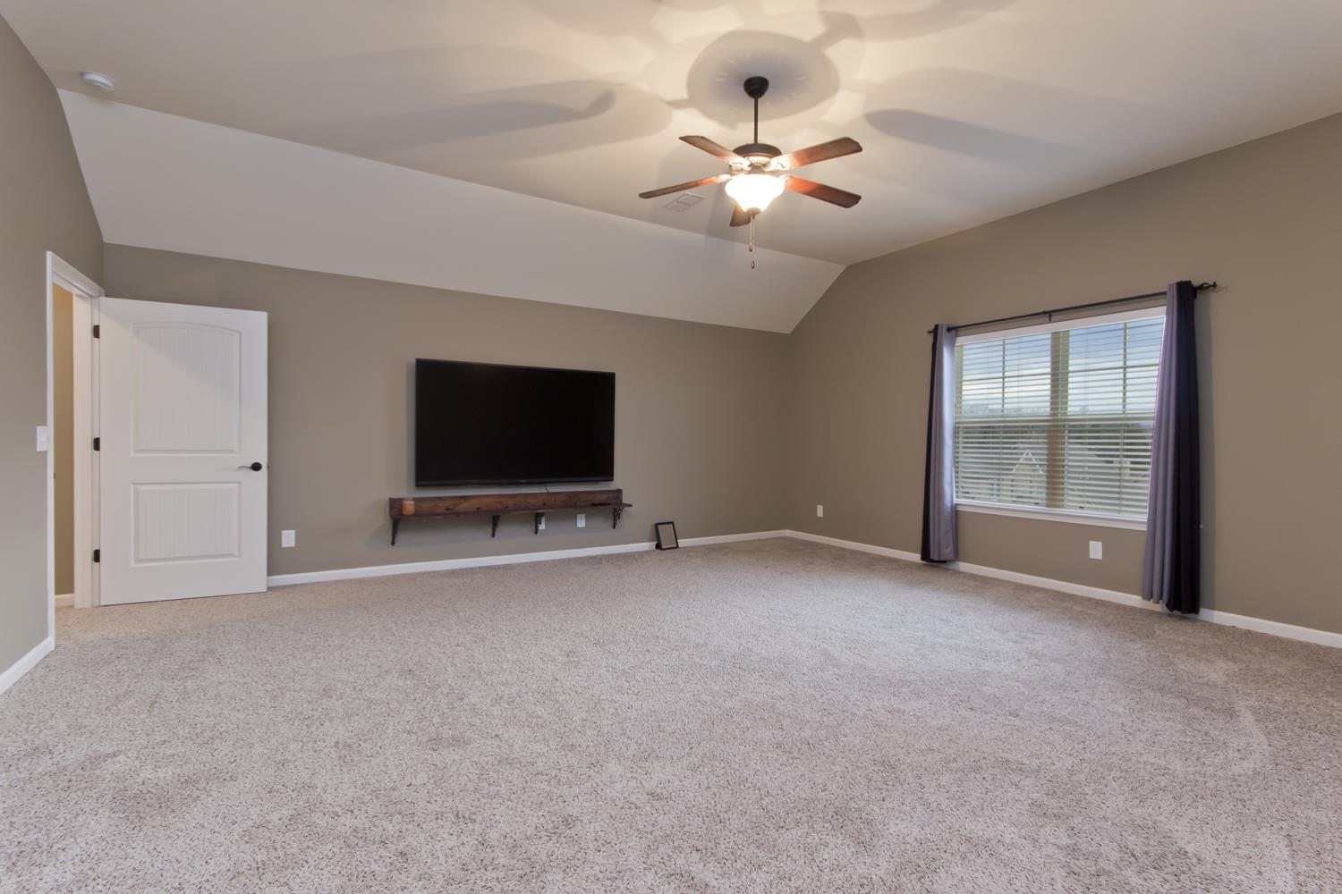 1011 Kyle Road Spring Hill, TN 37174 - Photo 21 of 30 a view of an empty room with a flat screen tv