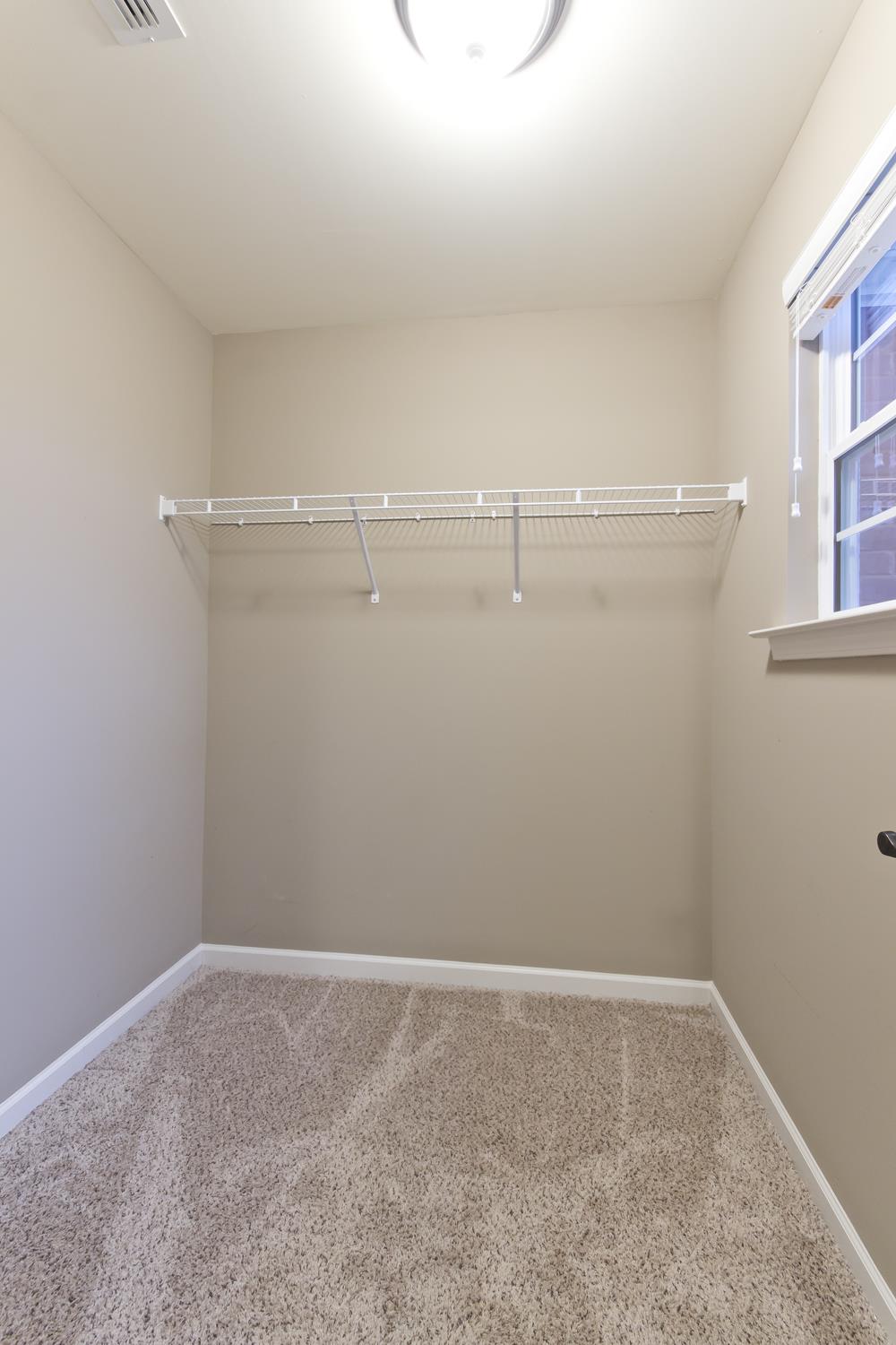 1011 Kyle Road Spring Hill, TN 37174 - Photo 24 of 30 a view of a room with racks on the wall