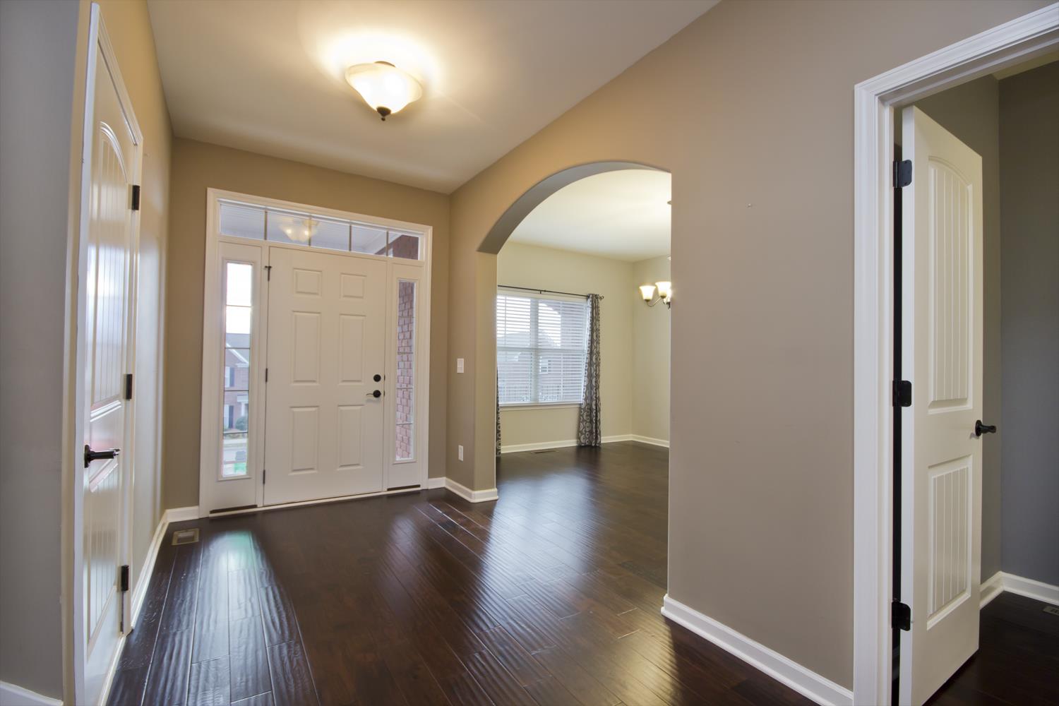 1011 Kyle Road Spring Hill, TN 37174 - Photo 4 of 30 an empty room with wooden floor and a window