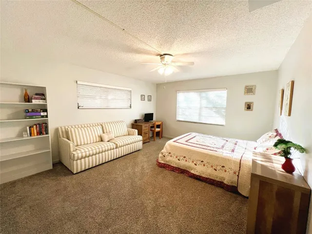 a bed room with a bed and a window