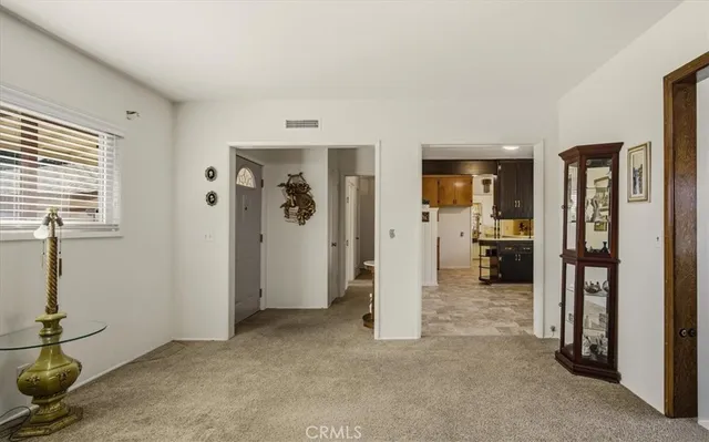 a living room with furniture and windows