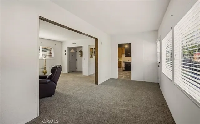 a kitchen with stainless steel appliances granite countertop a refrigerator and a stove
