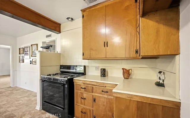 a kitchen with a sink cabinets and window
