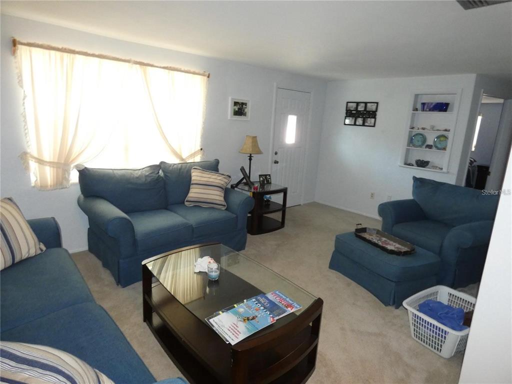 4392 Craftsbury Drive New Port Richey, FL 34652 - Photo 17 of 41 a living room with furniture and a large window