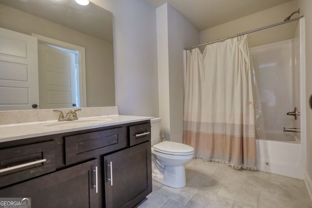 83 Bella Drive Monroe, GA 30655 - Photo 22 of 33 a bathroom with a sink a toilet and shower