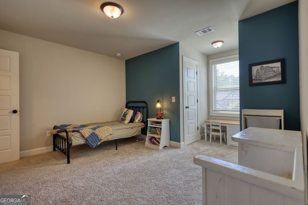 83 Bella Drive Monroe, GA 30655 - Photo 23 of 33 a living room with furniture and a table