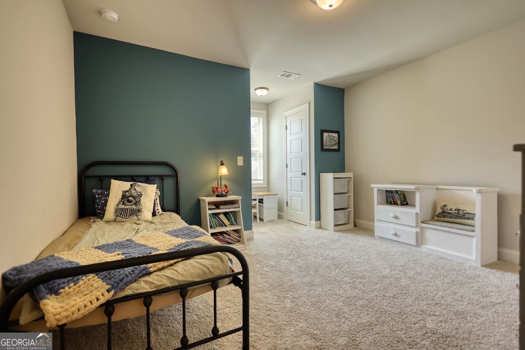 83 Bella Drive Monroe, GA 30655 - Photo 24 of 33 a bedroom with a bed and a view of bedroom