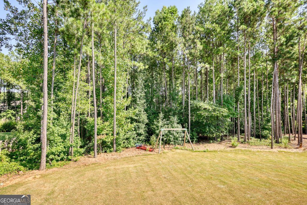 83 Bella Drive Monroe, GA 30655 - Photo 28 of 33 a view of a house with a yard and tree