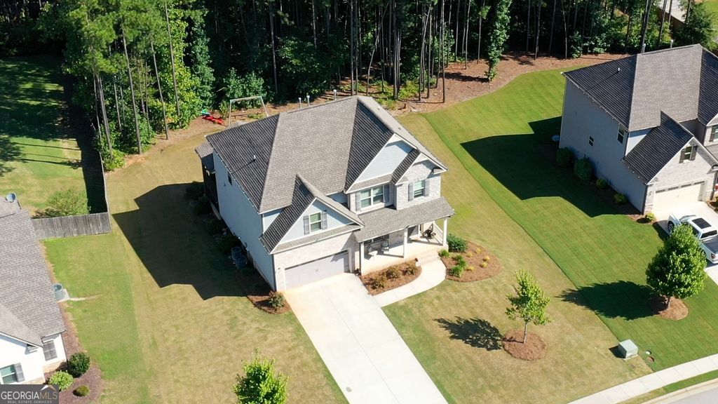 83 Bella Drive Monroe, GA 30655 - Photo 30 of 33 an aerial view of a house with a yard