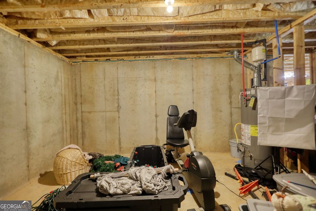 83 Bella Drive Monroe, GA 30655 - Photo 33 of 33 a room with a couch and a table