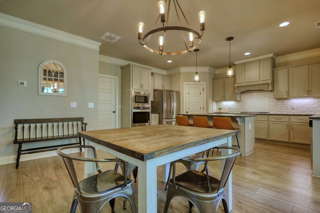 83 Bella Drive Monroe, GA 30655 - Photo 4 of 33 a kitchen with a table and chairs