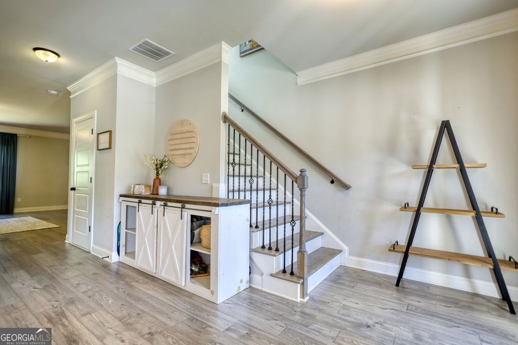 83 Bella Drive Monroe, GA 30655 - Photo 8 of 33 a view of entryway with wooden floor