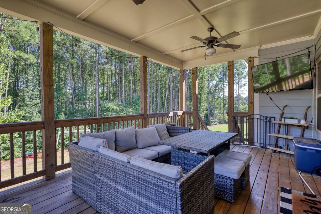 83 Bella Drive Monroe, GA 30655 - Photo 9 of 33 a living room with furniture and a large window