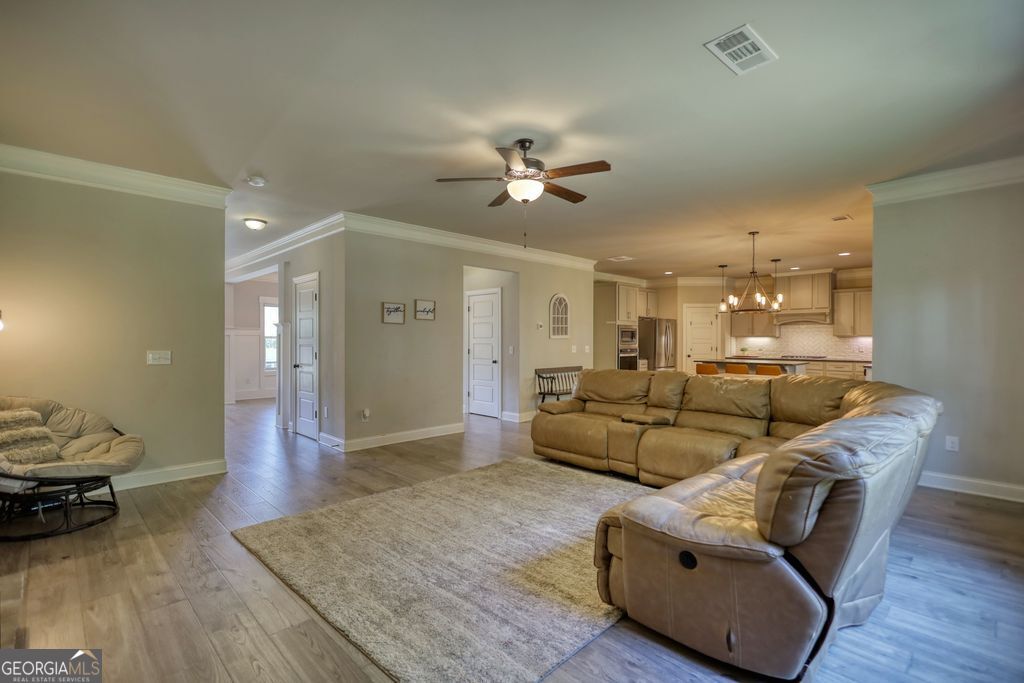 83 Bella Drive Monroe, GA 30655 - Photo 10 of 33 a living room with furniture and wooden floor