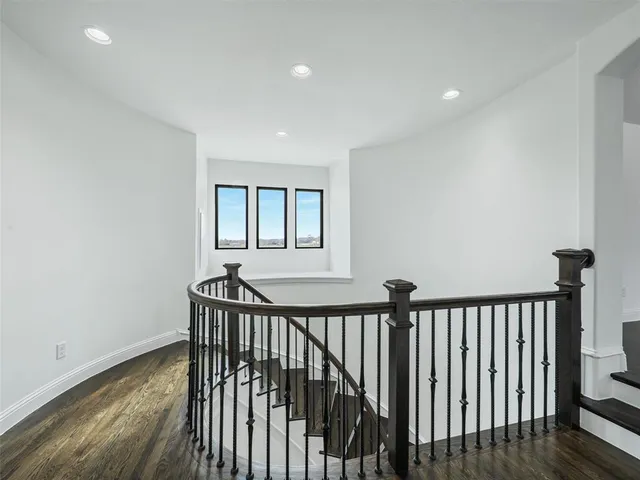 a view of a hallway with a window