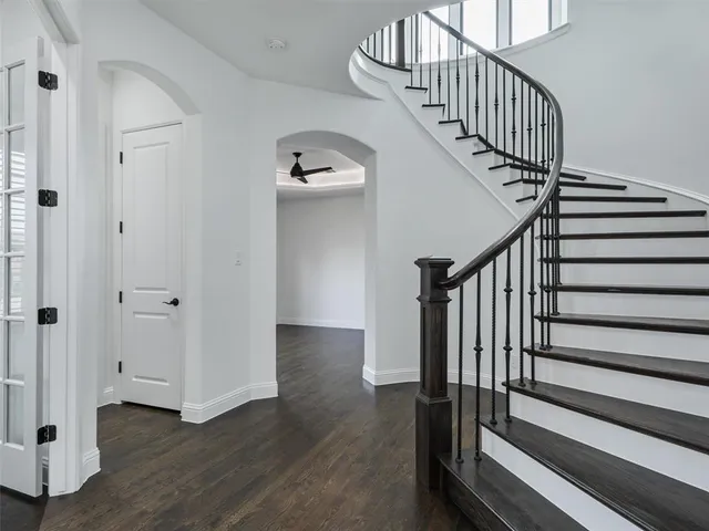 a view of entryway with wooden floor and stairs