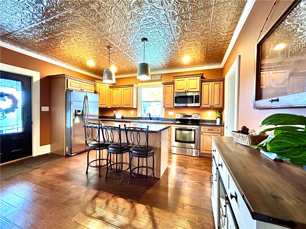 2086 Scheyhing Road Lewisburg, OH 45338 - Photo 12 of 29 This kitchen showcases stainless steel appliances and beautiful hardwood flooring.