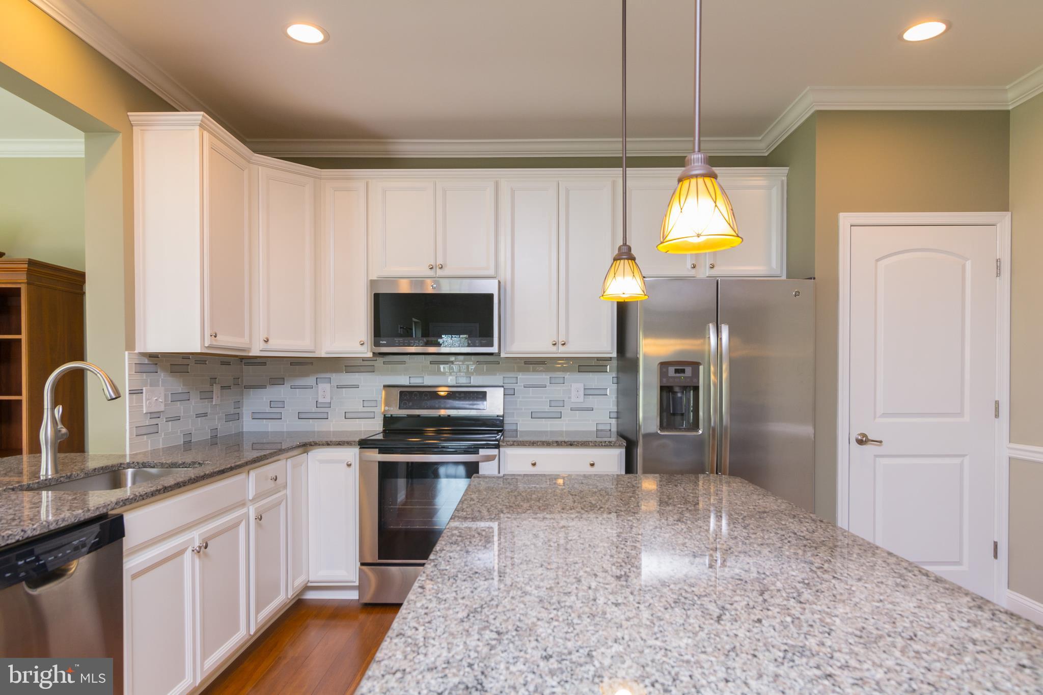 36980 Grove Estate Road Lewes, DE 19958 - Photo 8 of 29 Glass-Tile Backsplash & Stainless Steel Appliances