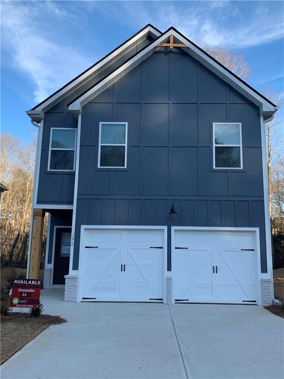 a front view of a house with parking area