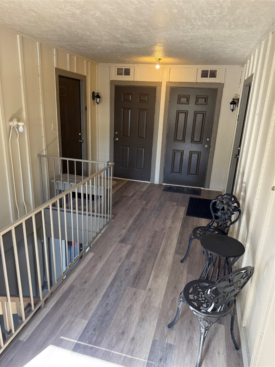 505 Waco Street, Unit 3 Conroe, TX 77301 - Photo 11 of 11 a view of a porch with wooden floor