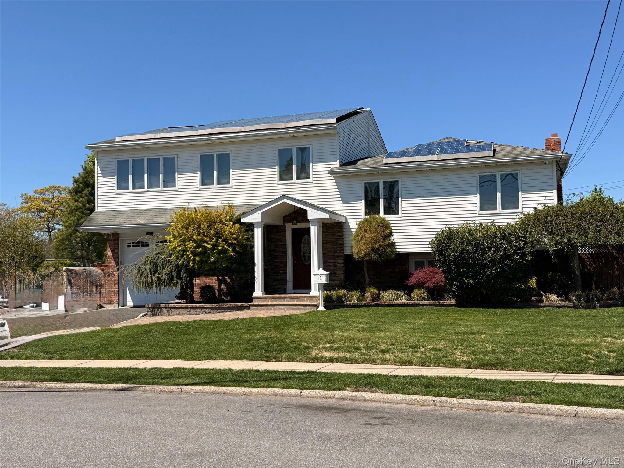 345 O'Connor Road North Babylon, NY 11703 - Photo 1 of 47 a front view of a house with a yard