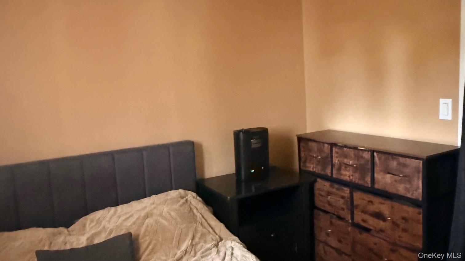 345 O'Connor Road North Babylon, NY 11703 - Photo 26 of 47 a bed sitting in a bedroom next to a window