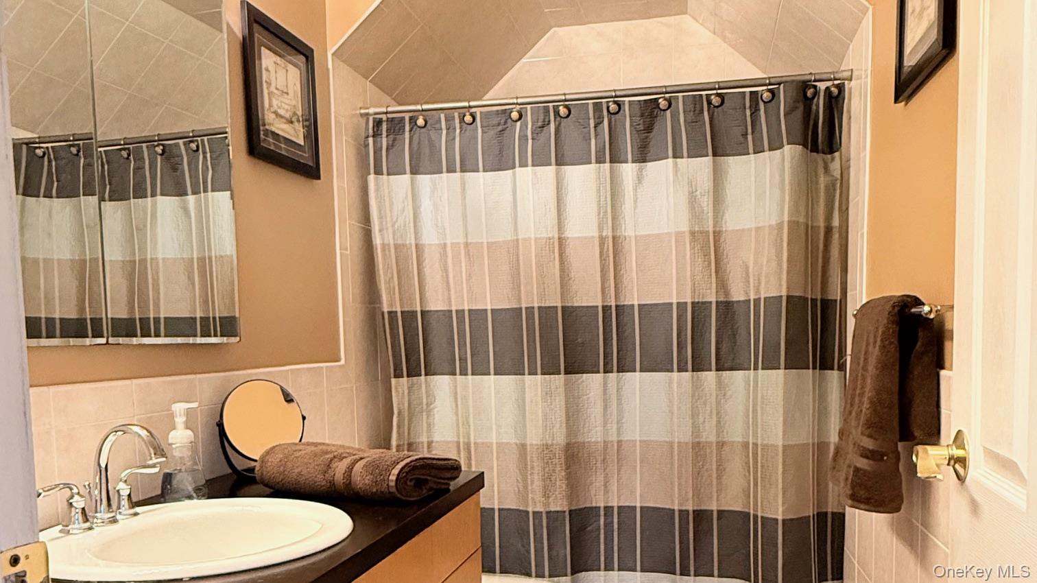 345 O'Connor Road North Babylon, NY 11703 - Photo 30 of 47 a bathroom with a sink and a mirror