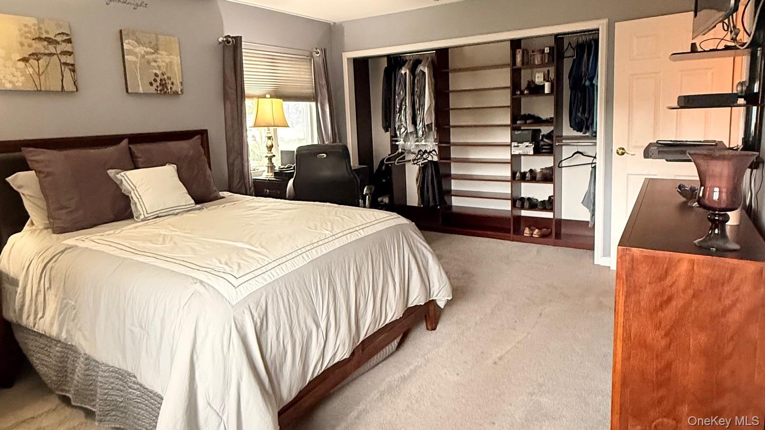 345 O'Connor Road North Babylon, NY 11703 - Photo 32 of 47 a bedroom with a bed and a walk in closet