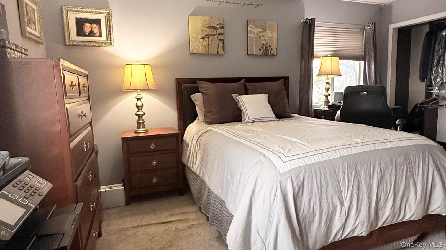345 O'Connor Road North Babylon, NY 11703 - Photo 33 of 47 a bedroom with a bed and a flat screen tv