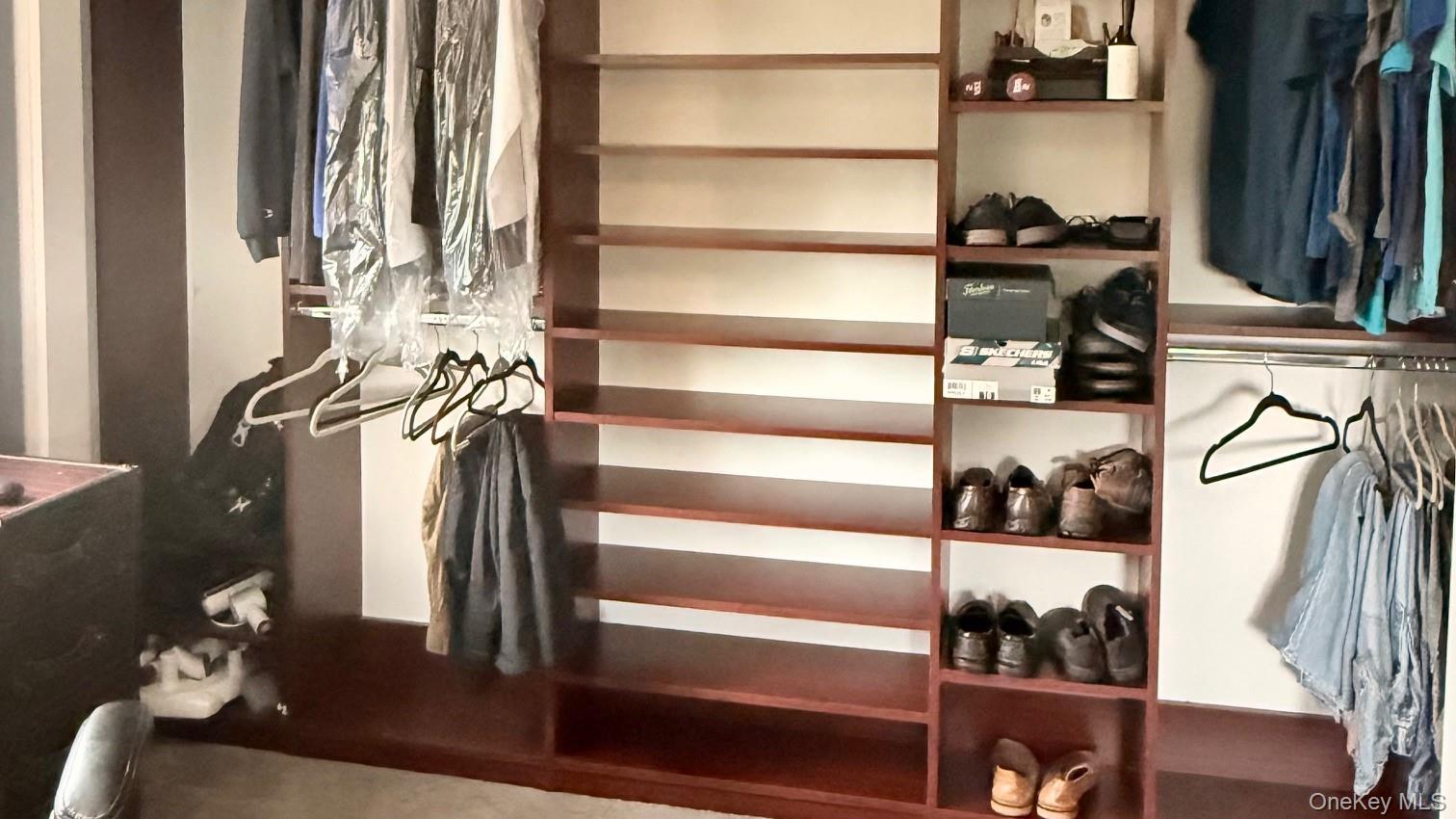 345 O'Connor Road North Babylon, NY 11703 - Photo 38 of 47 a view of walk in closet with clothes and shoes