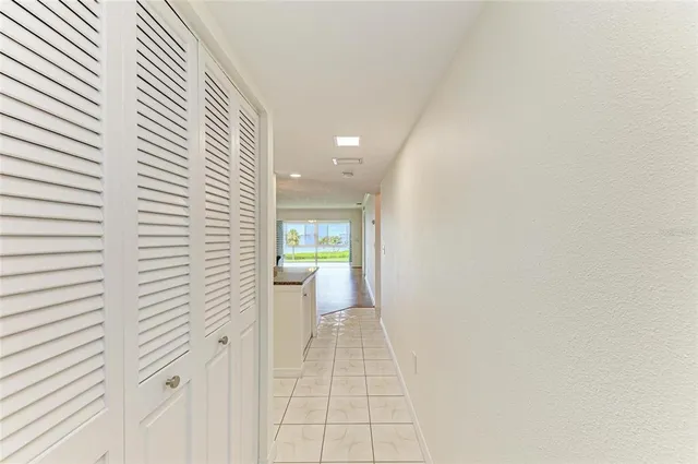 a kitchen with granite countertop a sink and cabinets