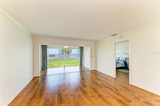 a view of an empty room with glass door