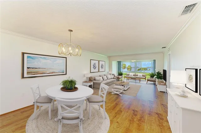 a bedroom with a bed and a large window with the outer view