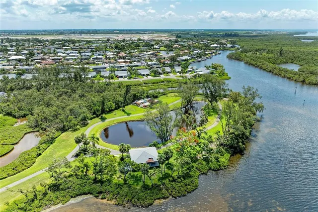 a view of a livingroom with furniture and windows
