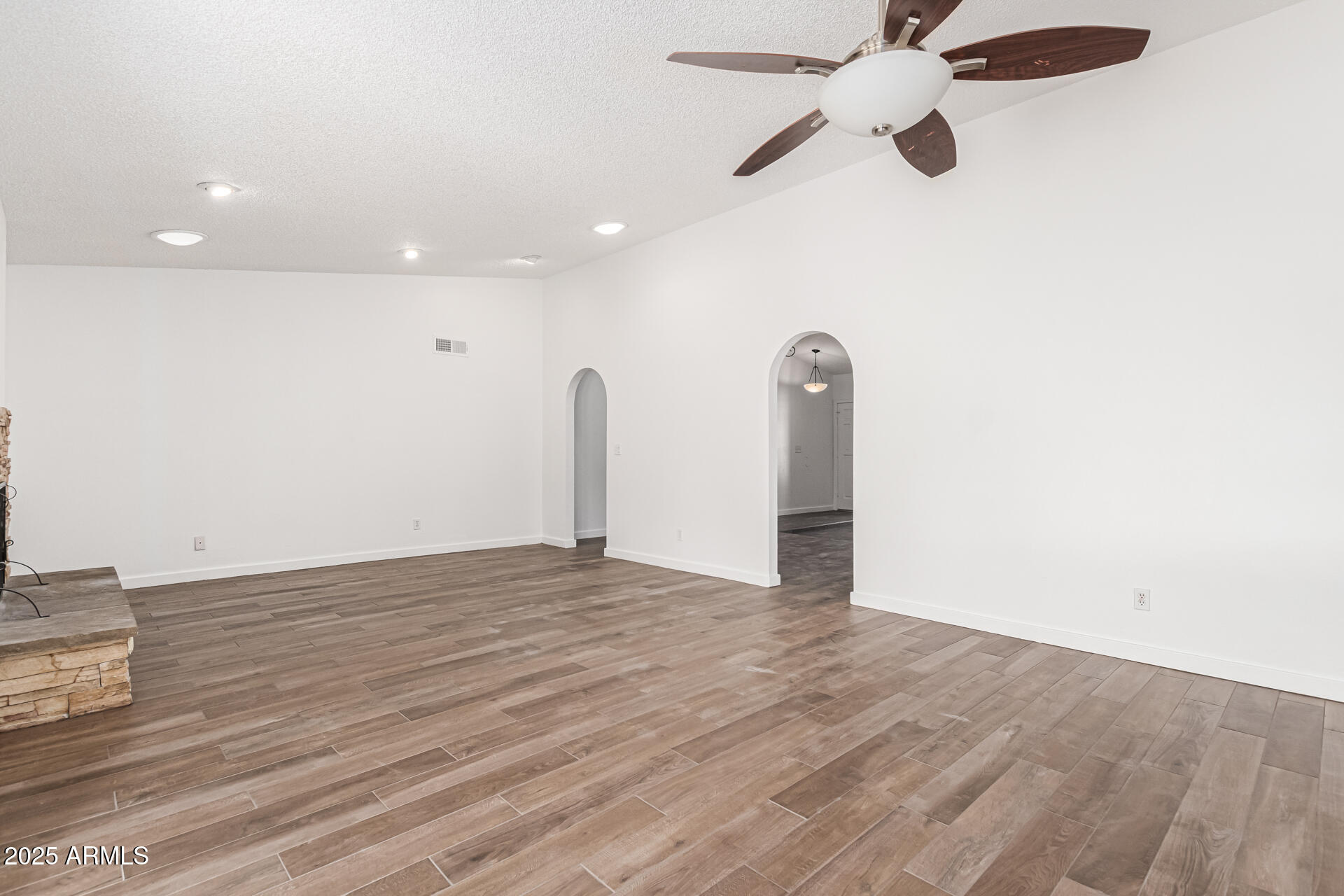 14034 North 60th Street Scottsdale, AZ 85254 - Photo 11 of 44 a view of empty room with wooden floor