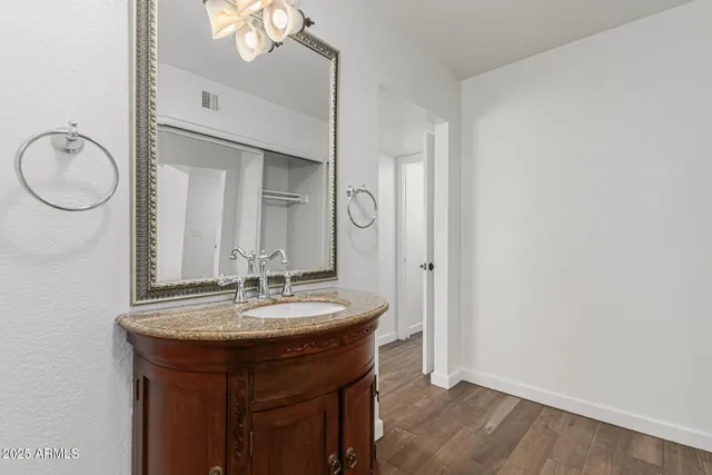 a bathroom with a glass shower door