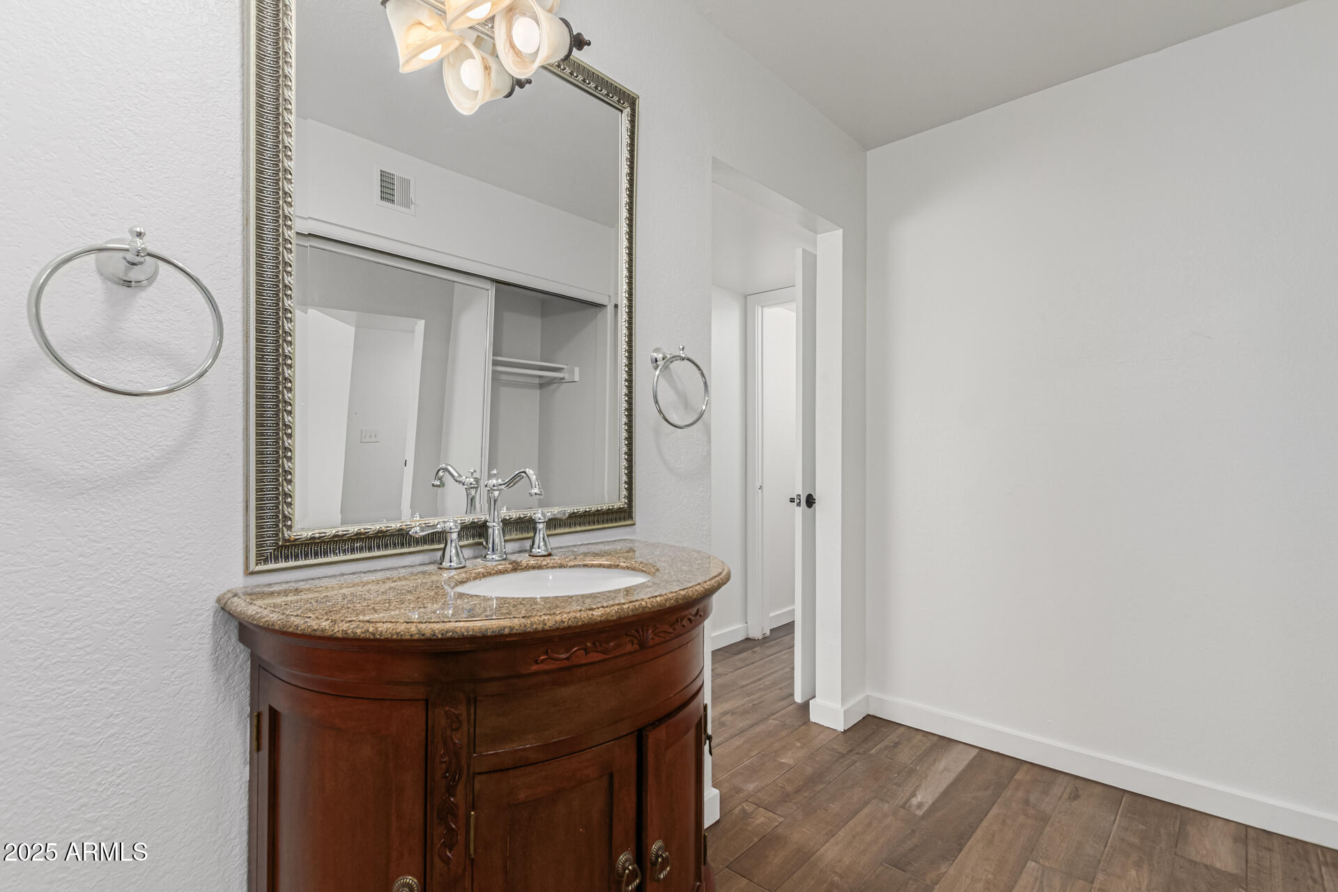 14034 North 60th Street Scottsdale, AZ 85254 - Photo 20 of 44 a bathroom with a sink and a mirror