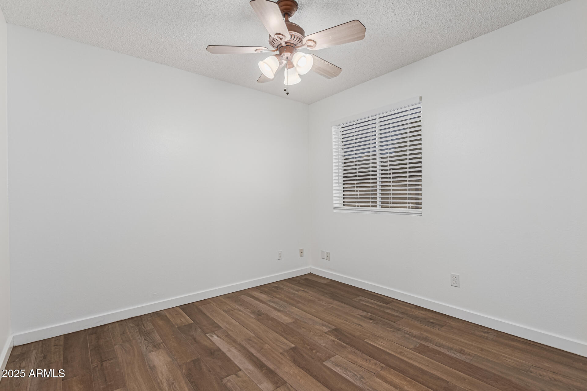 14034 North 60th Street Scottsdale, AZ 85254 - Photo 27 of 44 wooden floor in an empty room with a window