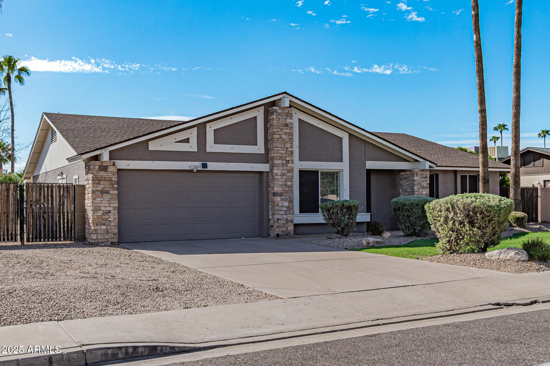 14034 North 60th Street Scottsdale, AZ 85254 - Photo 3 of 44 a front view of a house with a garage