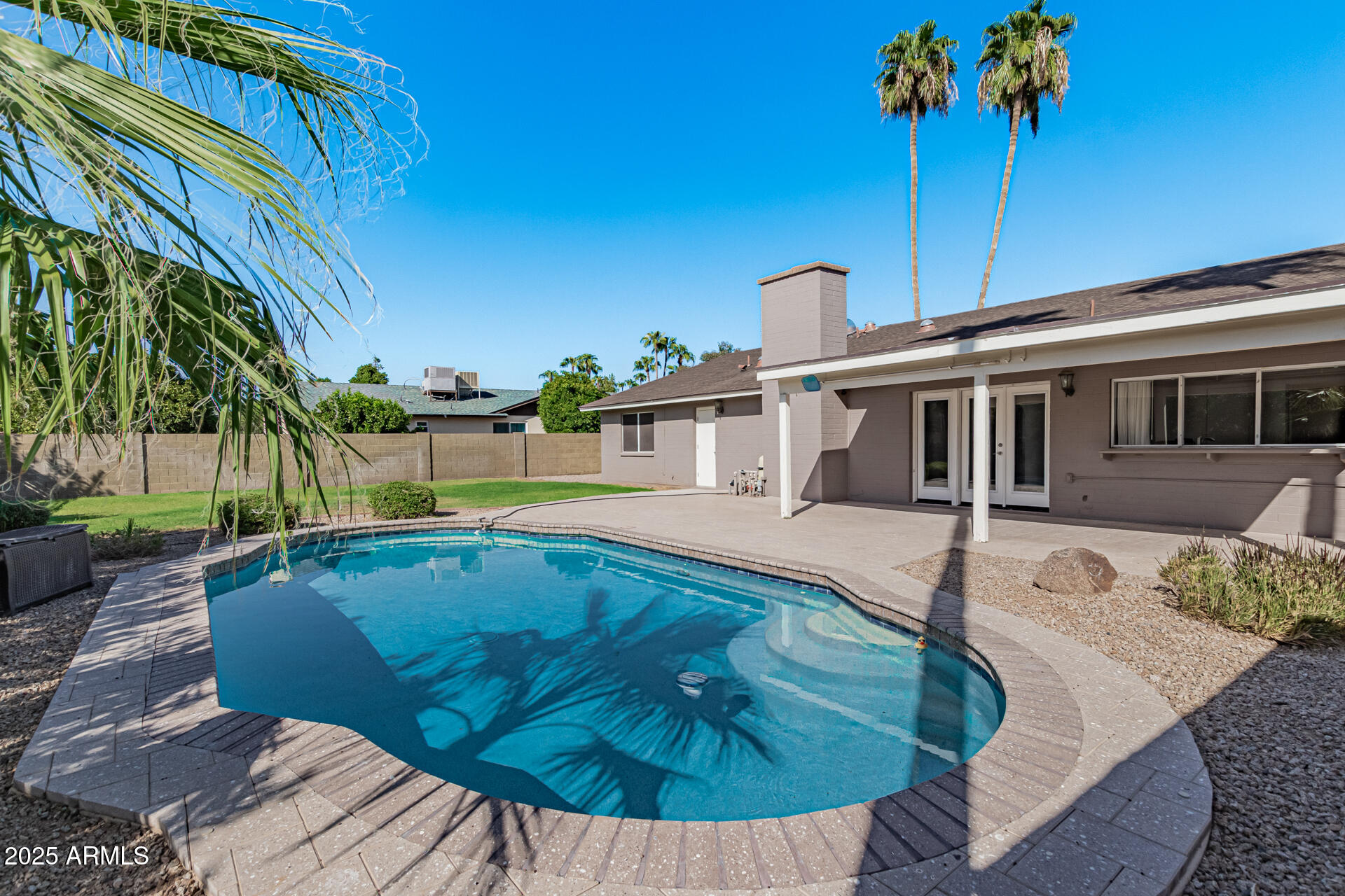 14034 North 60th Street Scottsdale, AZ 85254 - Photo 33 of 44 a view of a house with a swimming pool