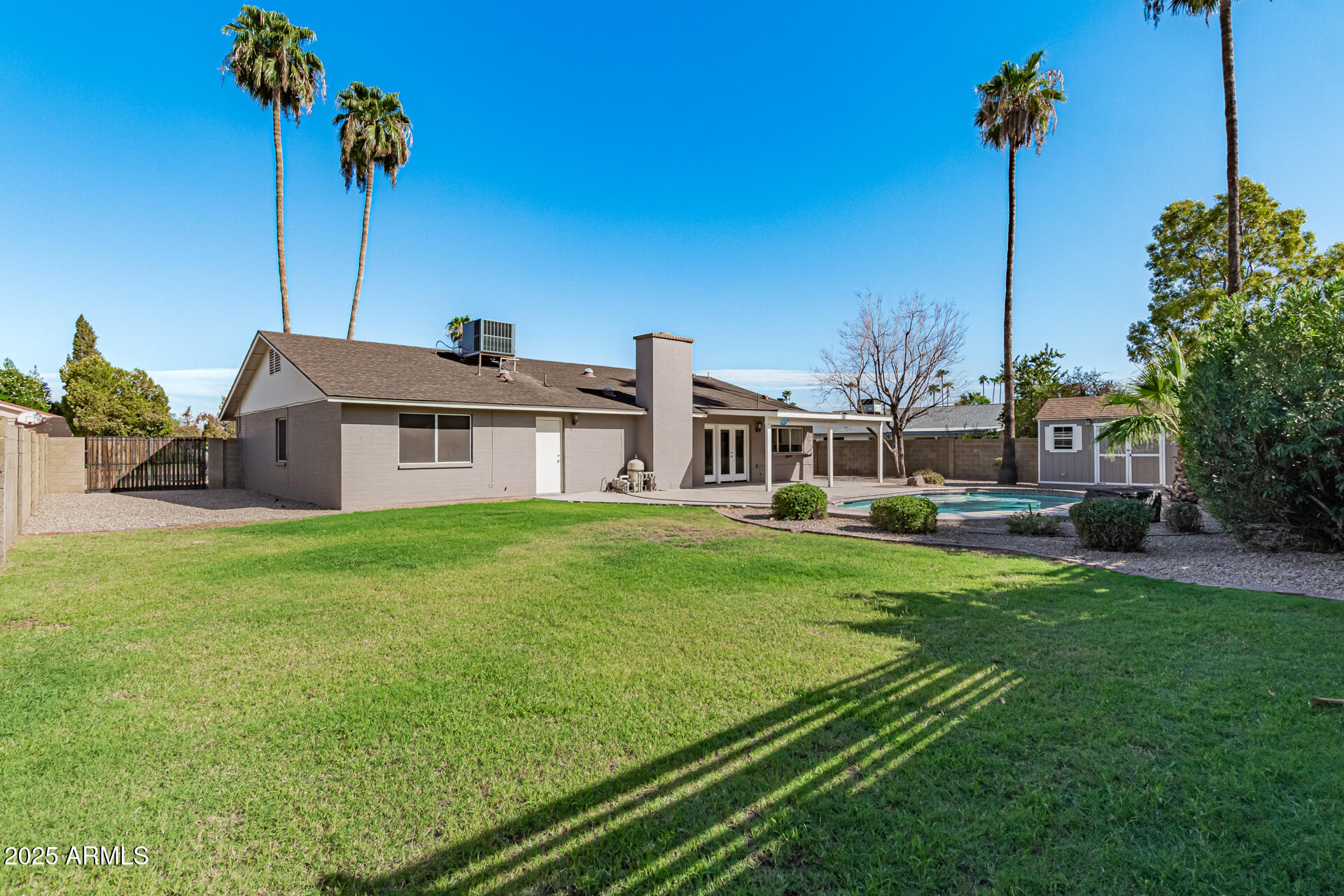 14034 North 60th Street Scottsdale, AZ 85254 - Photo 36 of 44 a front view of a house with garden