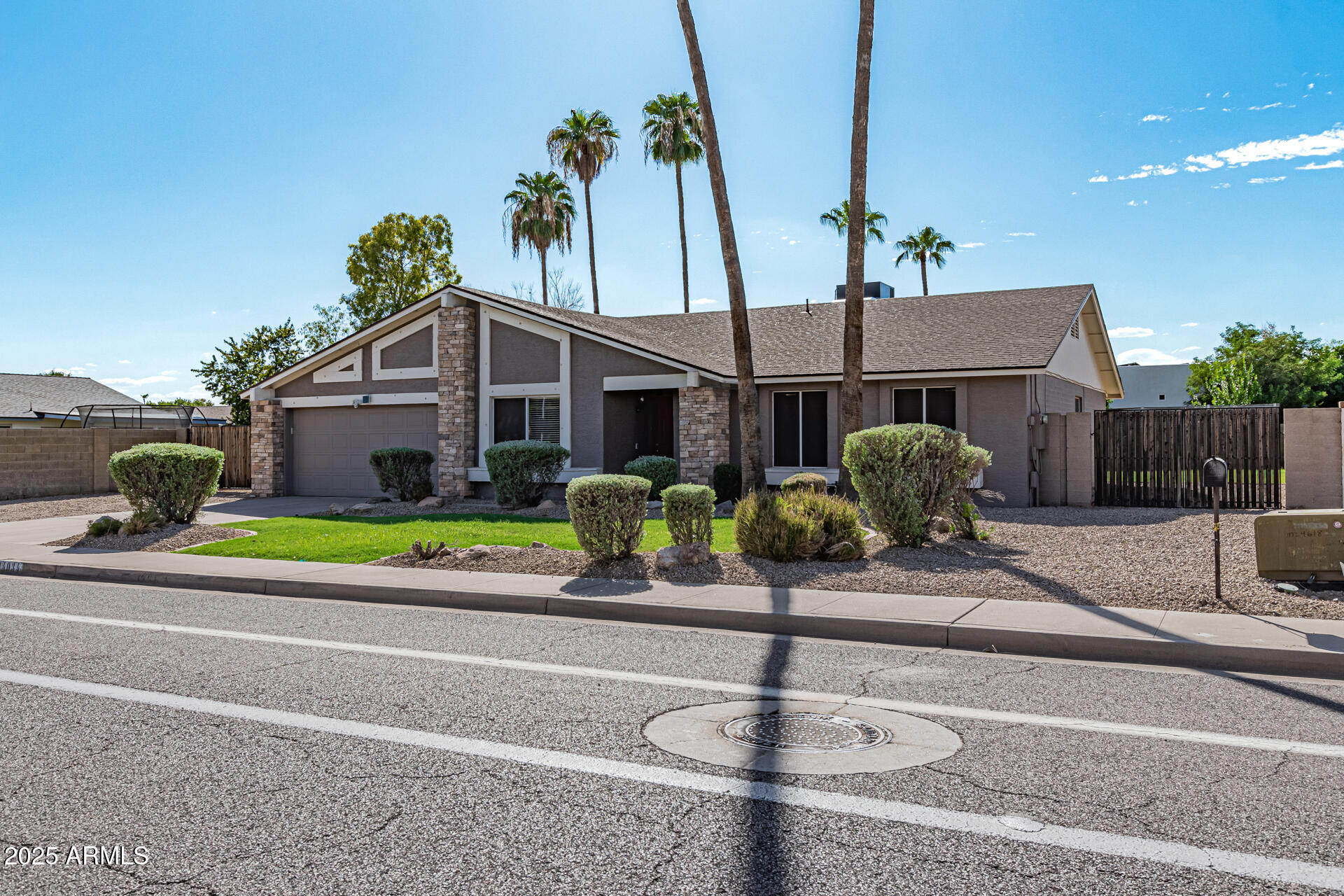 14034 North 60th Street Scottsdale, AZ 85254 - Photo 4 of 44 a swimming pool with a yard in front of it